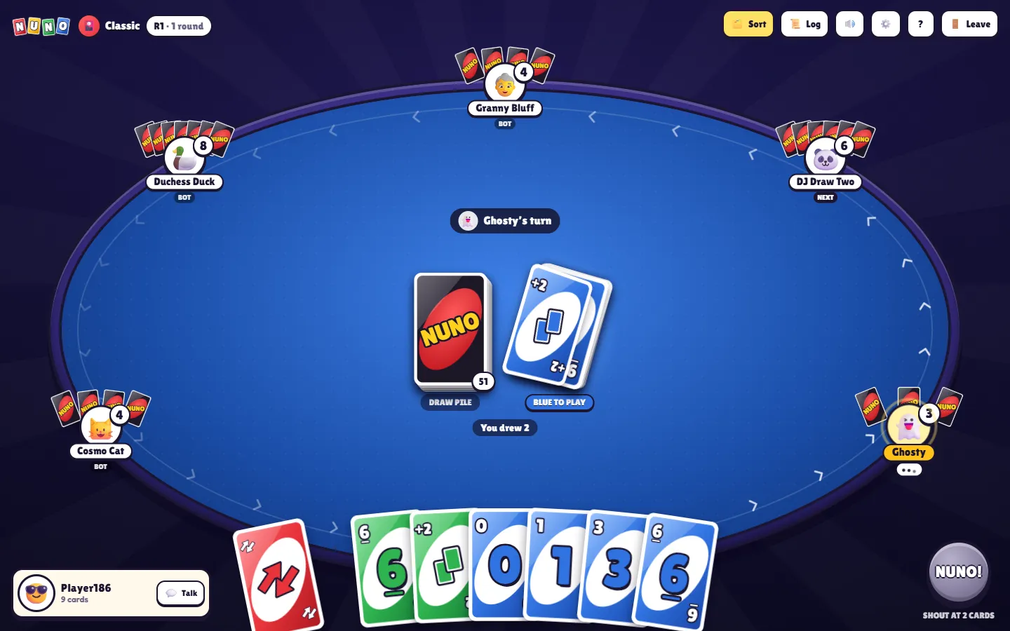 The same table with the felt turned blue after a blue Draw Two, and ‘You drew 2’ under the piles