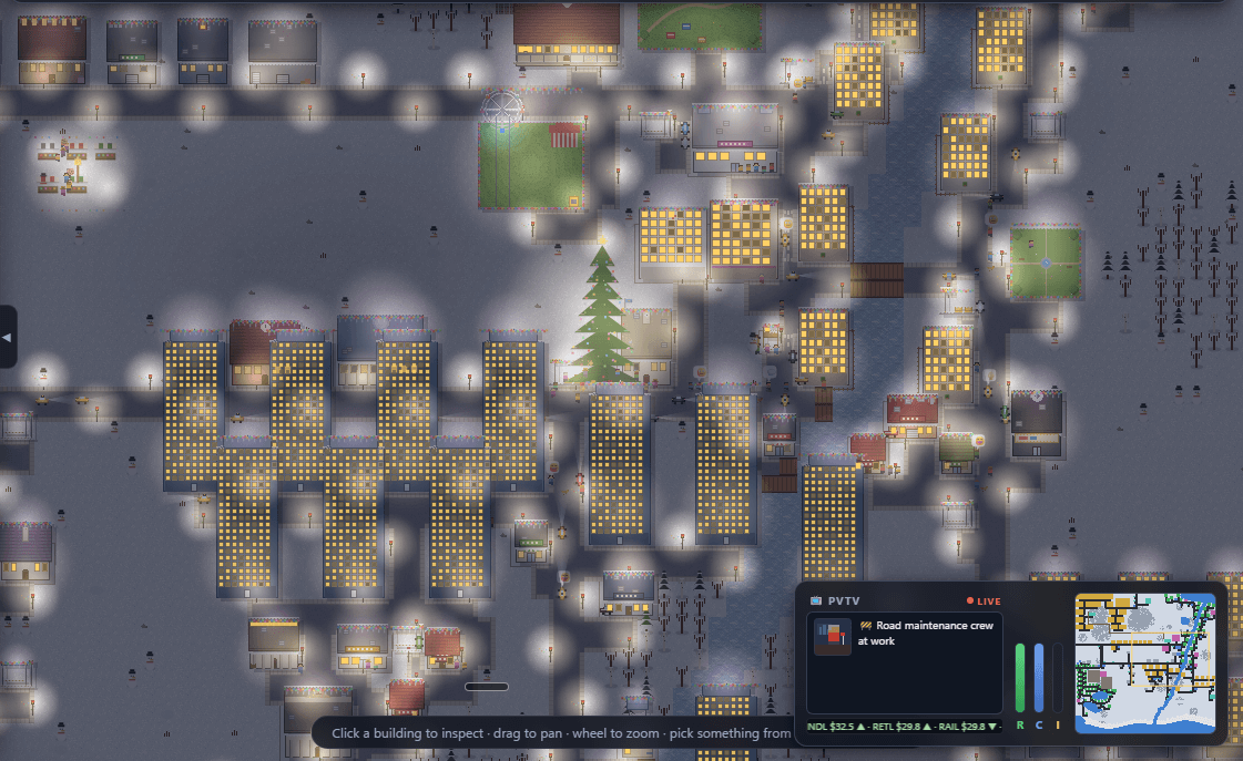 PixelVille at night — the lighting engine punches warm pools of light from glowing windows, street lamps and car headlights